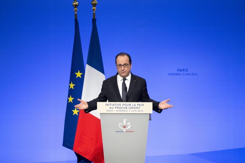 French president Francois Hollande delivers his speech at the opening of an international meeting in a bid to revive the Israeli-Palestinian peace process in Paris, France. Kamil Zihnioglu / AP Photo