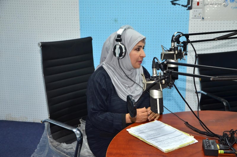 Afrah Mohammed Juma’a Khan talking on the radio. Courtesy Saeed Al Batati
