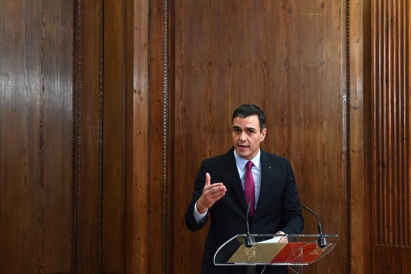 Spanish caretaker prime minister and candidate for re-election, socialist Pedro Sanchez deliver a speech after signing a coalition government agreement with far left Podemos party at the Congress in Madrid on December 30, 2019. / AFP / GABRIEL BOUYS                     
