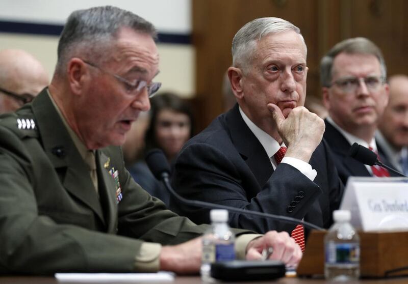 US chairman of the joint chiefs of staff General Joseph Dunford, left, speaks as defence secretary Jim Mattis, and defence under secretary David Norquist listen during a House armed services committee hearing on the 2018 defence budget, on Capitol Hill, Washington, on June 12, 2017. Alex Brandon / AP Photo