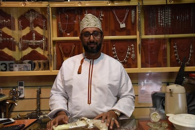 Khalid Al Tiwani shows off a khanjar in his Nizwa shop. Courtesy Ismael David. 