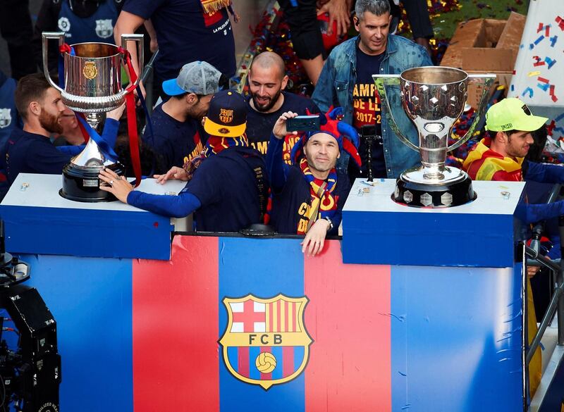 Andres Iniesta and his Barcelona teammates during the celebrations. Alejandro Garcia / EPA