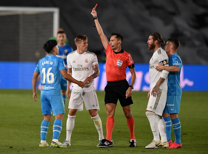 Lee Kang-In of Valencia  is shown a red card by referee Jose Maria Sanchez Martinez. Getty