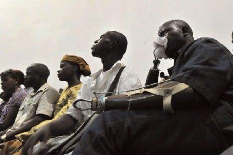 Victims of the civil war in Sierra Leone watch the trial of Liberian ex-leader, Charles Taylor, taking place in The Hague on television in Freetown. Taylor was found guilty of aiding and abetting as well as planning crimes, but he was acquitted of directly ordering crimes.