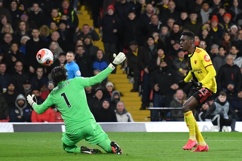 Watford's Senegalese midfielder Ismaila Sarr (R) scores his team's second goal past Liverpool's Brazilian goalkeeper Alisson Becker during the English Premier League football match between Watford and Liverpool at Vicarage Road Stadium in Watford, north of London on February 29, 2020. (Photo by JUSTIN TALLIS / AFP) / RESTRICTED TO EDITORIAL USE. No use with unauthorized audio, video, data, fixture lists, club/league logos or 'live' services. Online in-match use limited to 120 images. An additional 40 images may be used in extra time. No video emulation. Social media in-match use limited to 120 images. An additional 40 images may be used in extra time. No use in betting publications, games or single club/league/player publications. / 