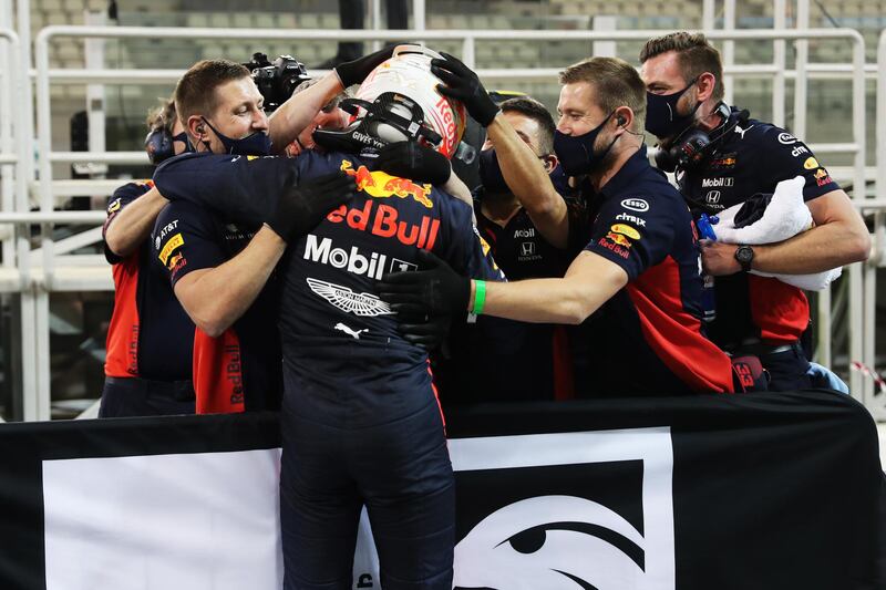 Max Verstappen of Netherlands and Red Bull Racing celebrates with his team after a blistering last lap at Yas Marina Circuit secured pole position for Sunday's Etihad Airways Abu Dhabi Grand Prix. Getty Images