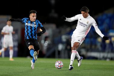 MADRID, SPAIN - NOVEMBER 03: Raphael Varane of Real Madrid and Lautaro Martinez of Inter Milan clash during the UEFA Champions League Group B stage match between Real Madrid and FC Internazionale at Estadio Alfredo Di Stefano on November 03, 2020 in Madrid, Spain. Football Stadiums around Europe remain empty due to the Coronavirus Pandemic as Government social distancing laws prohibit fans inside venues resulting in fixtures being played behind closed doors. (Photo by Gonzalo Arroyo Moreno/Getty Images)