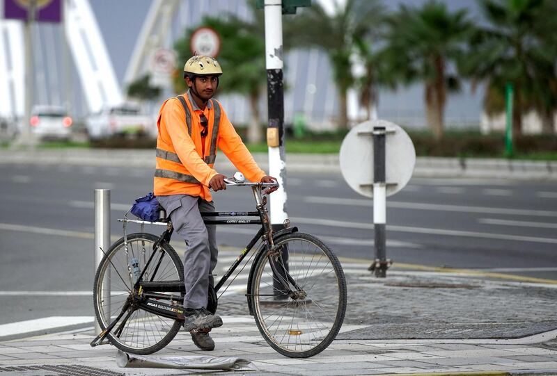 Abu Dhabi, United Arab Emirates, March 21, 2020.   A worker on his way to work at the Al Bandar area on a gloomy day.
Victor Besa / The National
Reporter:   
Section: