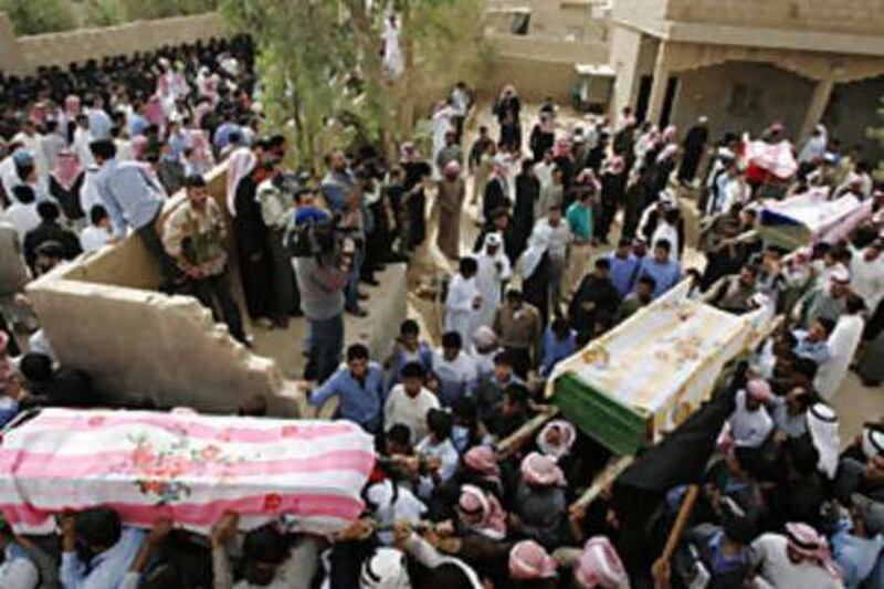 Villagers carry the coffins of relatives who died when US military helicopters launched an attack on Syrian territory.