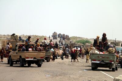 epa06768610 Yemeni government forces backed by the Saudi-led coalition take position at an area after seizing it from the Houthi militia in the western province of Hodeidah, Yemen, 27 May 2018 (issued 28 May 2018). According to reports, Yemeni troops backed by the Saudi-led coalition have moved closer to a key Houthis-held port and strategic city of Hodeidah after Yemeni government forces seized Houthis-held areas along the western coast. Most of Yemen's food and medicine imports and aid are shipped through Hodeidah port.  EPA/STRINGER