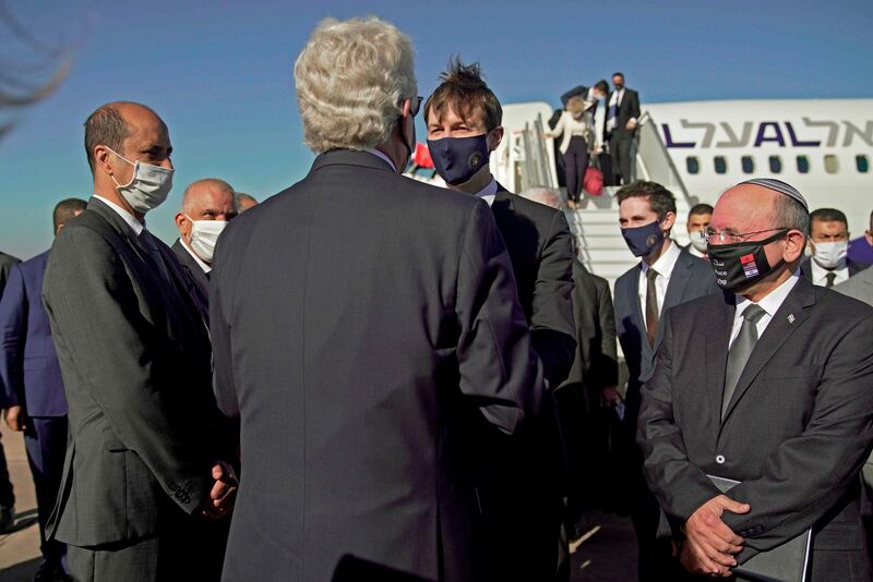 A handout picture released by the US Embassy in Morocco  shows US Ambassador David T. Fischer (2nd L) welcoming US Presidential advisor Jared Kushner and Israeli National Security Advisor Meir Ben Shabbat (R) in Moroco's capital Rabat, upon landing of the first Israel-Morocco direct commercial flight, marking the latest US-brokered diplomatic normalisation deal between the Jewish state and an Arab country. AFP