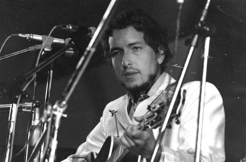 1969:  American singer-songwriter Bob Dylan in concert at the Isle of Wight Pop Festival.  (Photo by William Lovelace/Express/Getty Images)