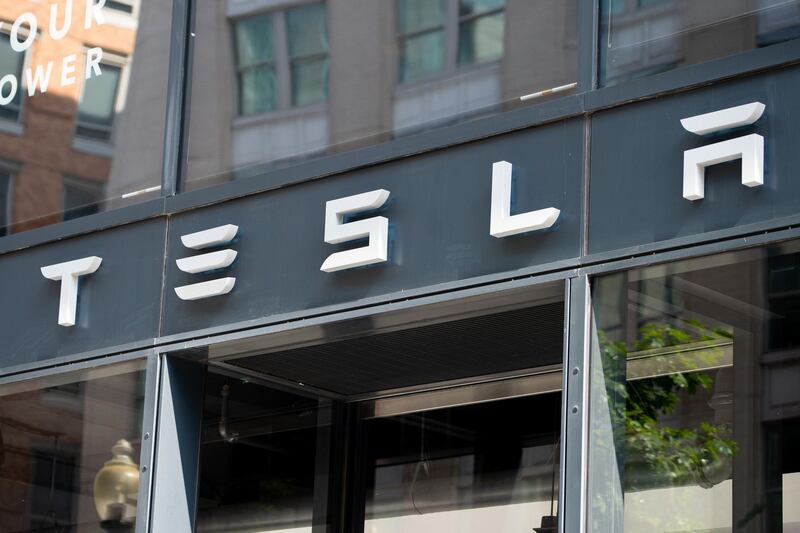 (FILES) In this file photo the Tesla logo is seen outside of their showroom in Washington, DC, on August 8, 2018. Wall Street stocks dipped early on February 26, 2019 ahead of a congressional appearance by the Federal Reserve chief and as Tesla retreated on CEO Elon Musk's latest clash with US regulators. About 12 minutes into trading, the Dow Jones Industrial Average stood at 25,995.96, down 0.4 percent.The broad-based S&P 500 slipped 0.1 percent to 2,792.40, while the tech-rich Nasdaq Composite Index declined 0.2 percent to 7,542.39.

 / AFP / SAUL LOEB
