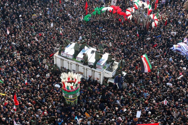Iranian people attend a funeral procession for Iranian Major-General Qassem Soleimani, head of the elite Quds Force, and Iraqi militia commander Abu Mahdi al-Muhandis, who were killed in an air strike at Baghdad airport, in Tehran, Iran January 6, 2020. Nazanin Tabatabaee/WANA (West Asia News Agency) via REUTERS/File photo      ATTENTION EDITORS - THIS IMAGE HAS BEEN SUPPLIED BY A THIRD PARTY     TPX IMAGES OF THE DAY      SEARCH "GLOBAL POY" FOR THIS STORY. SEARCH "REUTERS POY" FOR ALL BEST OF 2020 PACKAGES.