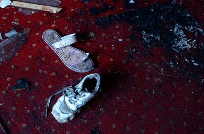 Abandoned shoes remain at the site of a fire inside the Abu Sefein Coptic church in the densely populated neighbourhood of Imbaba, Cairo Egypt in August. AFP