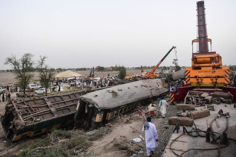 People gather at the site of the accident. AFP