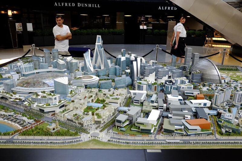 Above, the scale model of the Mall of World on display at Emirates Tower, which will be the world's largest shopping centre when built. Antonie Robertson / The National