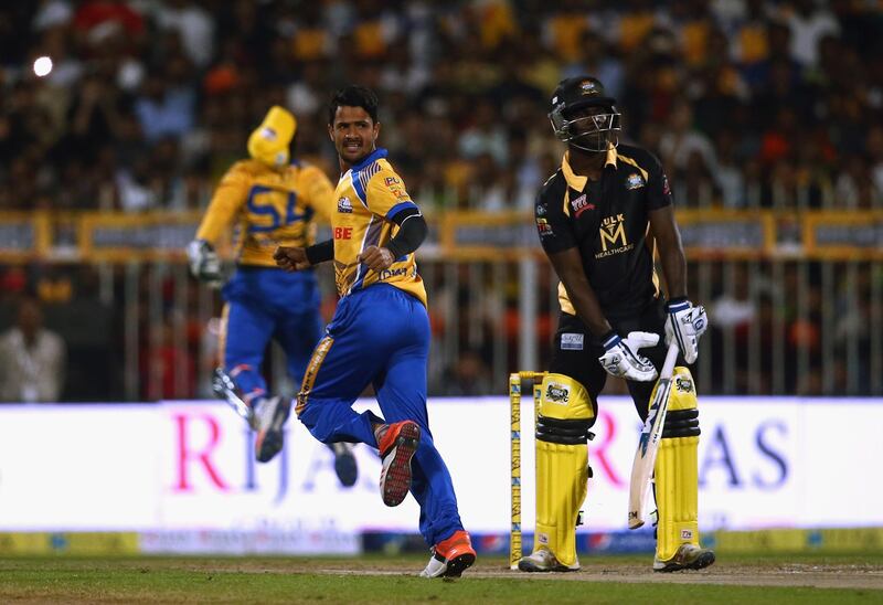 SHARJAH, UNITED ARAB EMIRATES - DECEMBER 14:Aamer Yami of Bengal tigers celebrates the wicket of Chadwick Walton during the T10 League match between Bengal Tigers and Kerala Kings at Sharjah Cricket Stadium on December 14, 2017 in Sharjah, United Arab Emirates.  (Photo by Francois Nel/Getty Images)