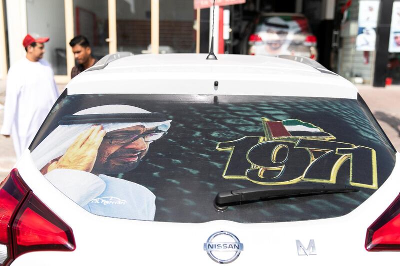 ABU DHABI, UNITED ARAB EMIRATES - NOVEMBER 27, 2018. 

Fahad Abd Al Moula, 26, decorates his car at Grand Plus Auto accessories.

Car accessory shops in Mussafah are keeping busy as motorists rush to dress up their vehicles ahead of the UAE's 47th National Day.

(Photo by Reem Mohammed/The National)

Reporter:  HANEEN DAJANI
Section:  NA