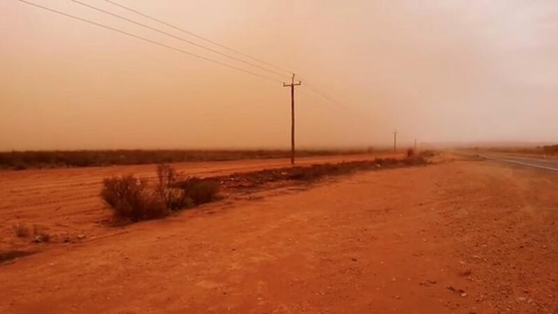 A road is shrouded in a cloud of dust as a dust storm descends upon West Broken Hill. @outbackimagesphotography / Rueters