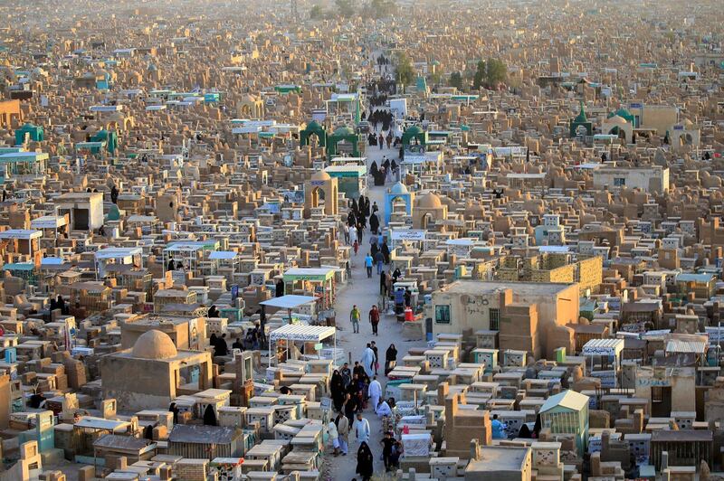 People visit the 'Valley of Peace' cemetery during Eid al Fitr as they mark the end of the fasting month of Ramadan, in Najaf, Iraq. Alaa Al-Marjani / Reuters
