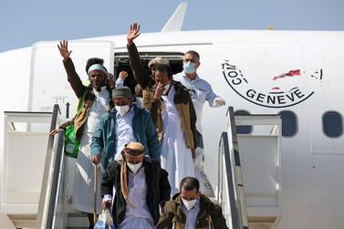 Freed Saudi-led coalition prisoners wave as they arrive after their release in a prisoner swap, at Sayoun airport, Yemen. Reuters