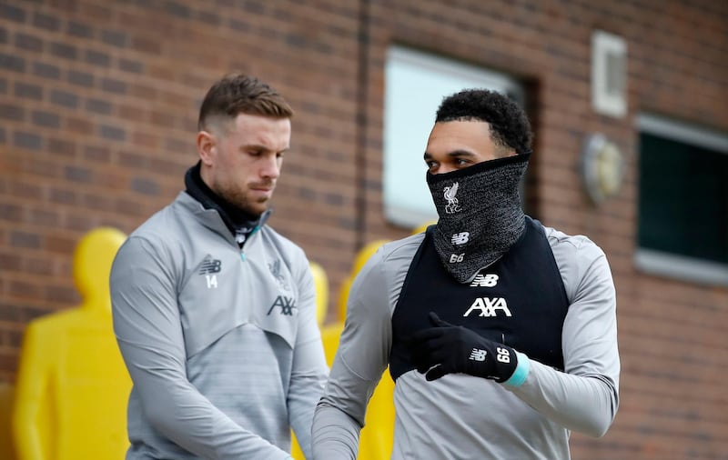 Liverpool's Jordan Henderson, left,  and Trent Alexander-Arnold. PA