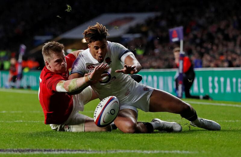 Rugby Union - Six Nations Championship - England vs Wales - Twickenham Stadium, London, Britain - February 10, 2018   England’s Anthony Watson in action with Wales’ Gareth Anscombe before a try is disallowed for Wales     Action Images via Reuters/Paul Childs     TPX IMAGES OF THE DAY