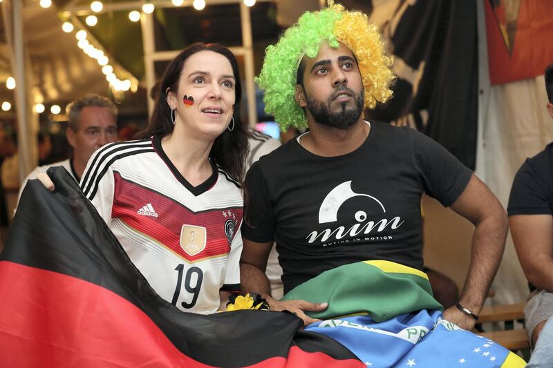 Dubai, United Arab Emirates - June 17th, 2018: A Brazil fan and a German fan during the game between Brazil and Switzerland. Sunday, June 17th, 2018 in Media One, Dubai. Chris Whiteoak / The National