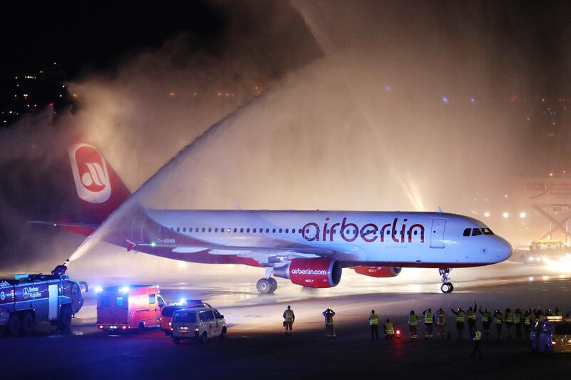 BERLIN, GERMANY - OCTOBER 27:  Fire trucks shoot ceremonial bursts of water to celebrate the arrival of Air Berlin flight AB 6210 from Munich at Tegel Airport on October 27, 2017 in Berlin, Germany. Flight AB 6210 was the last Air Berlin flight to fly as the comapny ceases operations today following its recent bankruptcy. Lufthansa is taking over a large portion of the planes and flight routes and EasyJet is in negotiations. Air Berlin began operating in 1979 as an American charter airline out of Cold War-era West Berlin.  (Photo by Sean Gallup/Getty Images)