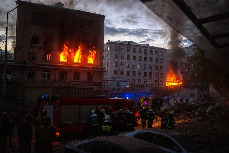 A fire after an air strike in Kyiv on April 28, shortly after a meeting between Ukrainian President Volodymyr Zelenskyy and UN Secretary General António Guterres. AP