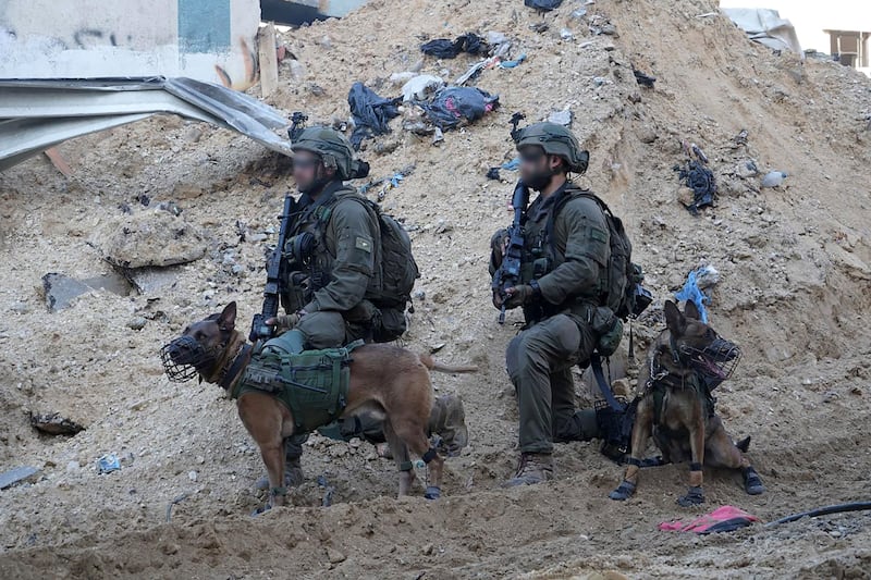 Israeli specialist operatives on the ground in the Gaza Strip. The armed forces have developed a 'hammer' tactic in which they reduce Hamas strongholds to rubble to avoid solider casualties, but this has significantly increased civilian deaths. AFP