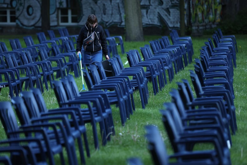 A cinema employee does a last-minute clean before people arrived to watch a film at the Freiluftkino Kreuzberg open-air cinema for the first time this year in Berlin, Germany. Getty Images