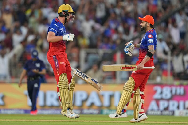 Royal Challengers Bengaluru's Will Jacks and teammate Virat Kohli celebrate their team's nine-wicket victory in the Indian Premier League game against Gujarat Titans in Ahmedabad on  Sunday, April 28, 2024. AP 