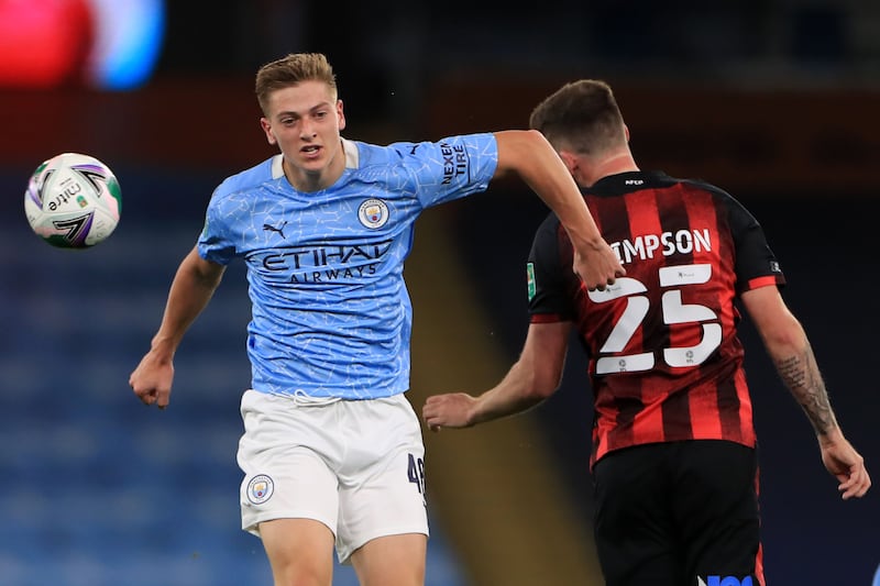 Manchester City's English midfielder Liam Delap (L) vies with Bournemouth's English defender Jack Simpson (R) during the English League Cup third round football match between Manchester City and Bournemouth at the Etihad Stadium in Manchester, north-west of England, on September 24, 2020.   - RESTRICTED TO EDITORIAL USE. No use with unauthorized audio, video, data, fixture lists, club/league logos or 'live' services. Online in-match use limited to 120 images. An additional 40 images may be used in extra time. No video emulation. Social media in-match use limited to 120 images. An additional 40 images may be used in extra time. No use in betting publications, games or single club/league/player publications.
 / AFP / POOL / MIKE EGERTON / RESTRICTED TO EDITORIAL USE. No use with unauthorized audio, video, data, fixture lists, club/league logos or 'live' services. Online in-match use limited to 120 images. An additional 40 images may be used in extra time. No video emulation. Social media in-match use limited to 120 images. An additional 40 images may be used in extra time. No use in betting publications, games or single club/league/player publications.
