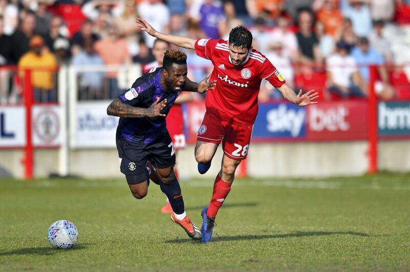 20th April 2019, Wham Stadium, Accrington, England; EFL League One football, Accrington Stanley versus Luton Town; Kazenga Lualua of Luton Town is fouled from behind by Seamus Conneely of Accrington Stanley (Photo by Simon Whitehead/Action Plus via Getty Images)