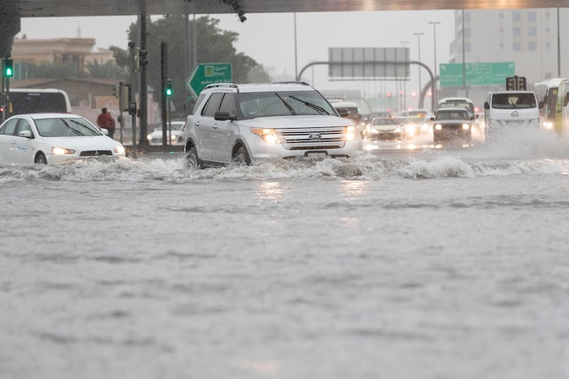 Vehicles navigate flooded roads cautiously in Al Quoz, Dubai. Antonie Robertson/The National
