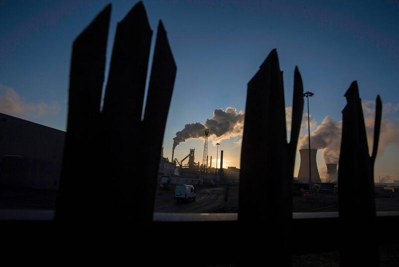 The sun rises above Tata Steel’s Scunthorpe Plant in north-east England. Lindsey Parnaby / AFP Photo