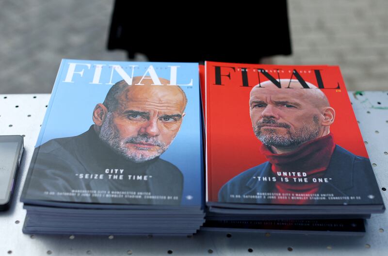 Match programmes featuring Manchester City manager Pep Guardiola and Manchester United manager Erik ten Hag at the Wembley Stadium. Reuters