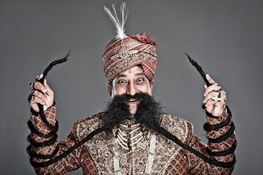 Ram Singh Chauhan is the owner of the world's longest moustache, which is 4.29m long. Courtesy Guinness World Records