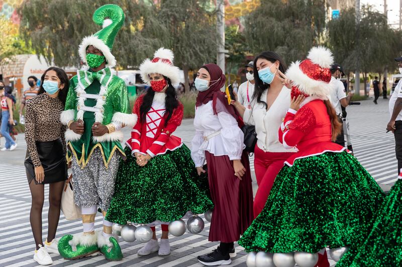 Visitors get their picture taken with some colourful festive characters.