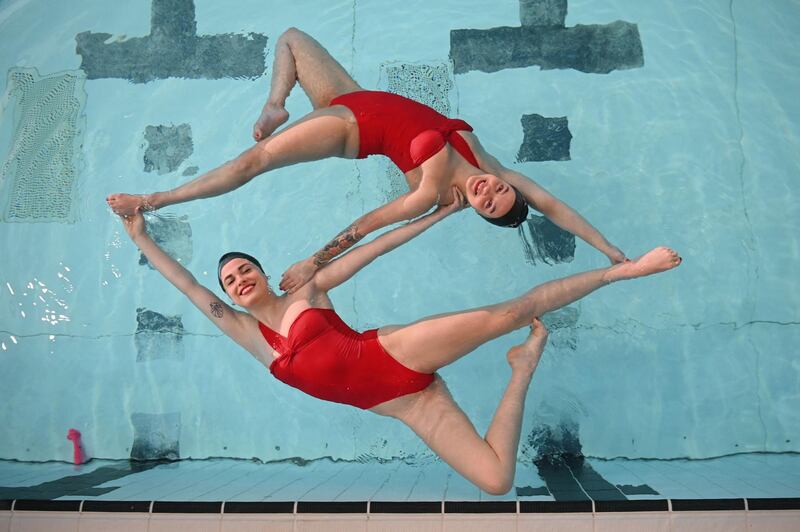 Members of Aquabatix, a synchronised swimming team practice at Clissold leisure centre in north London. AFP