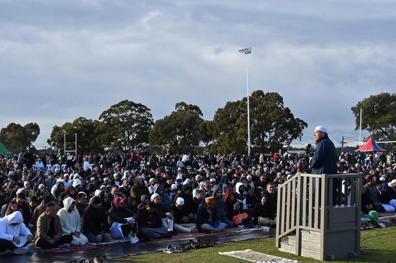 Muslims listen to a sermon during a gathering for congregational Eid Al Adha prayers at a park in Sydney.  Reuters