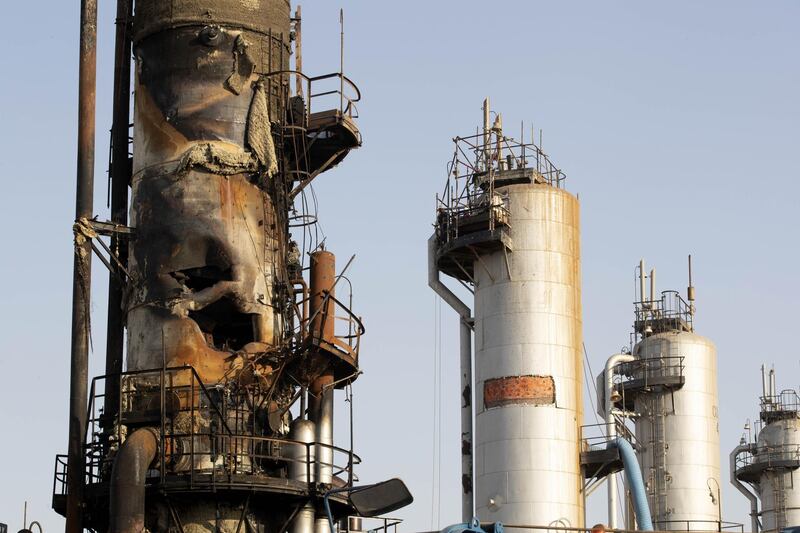 A damaged refining tower stands during repair at Saudi Aramco's Abqaiq crude oil processing plant following a drone attack in Abqaiq, Saudi Arabia, on Friday, Sept. 20, 2019. Saudi Aramco revealed the significant damage caused by an aerial strike on its Khurais oil field and Abqaiq crude-processing plant last weekend, and insisted that the sites will be back to pre-attack output levels by the end of the month. Photographer: Faisal Al Nasser/Bloomberg