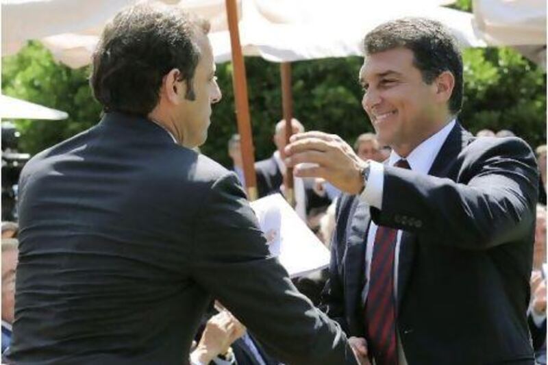 Sandro Rosell, left, has invited Joan Laporta, right, to attend games but all is not well.