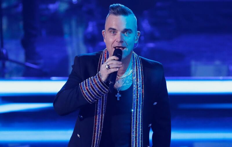 BERLIN, GERMANY - DECEMBER 07: British singer Robbie Williams performs onstage during the Ein Herz Fuer Kinder Gala show at Studio Berlin Adlershof on December 7, 2019 in Berlin, Germany. (Photo by Felipe Trueba - Pool/Getty Images)