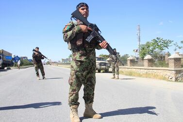 Afghan National Army officers stand guard at the site of a blast in Ghazni province, Afghanistan May 18, 2020. Reuters