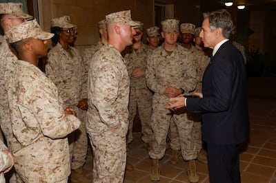 US Secretary of State Antony Blinken with US Marine Corps members in Baghdad last November. AP