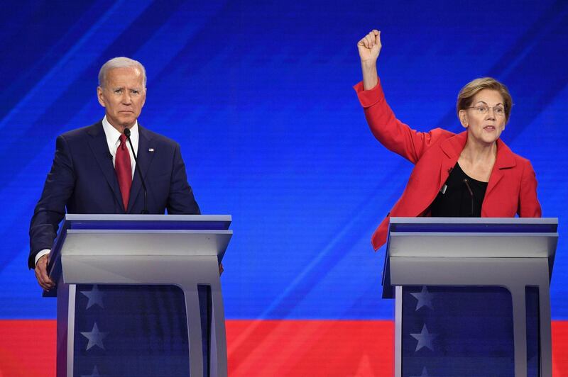 (FILES) In this file photo taken on September 12, 2019 Democratic presidential hopefuls Former Vice President Joe Biden (L) and Massachusetts Senator Elizabeth Warren participate in the third Democratic primary debate of the 2020 presidential campaign season hosted by ABC News in partnership with Univision at Texas Southern University in Houston, Texas. US Democratic presidential candidate Elizabeth Warren has squeezed ahead of long-time front-runner Joe Biden for the first time, according to compiled polls released October 8, 2019. The RealClearPolitics poll average put Warren on 26.6 percent and Biden on 26.4 percent in the Democratic primary contest to take on President Donald Trump in the 2020 election. / AFP / Robyn BECK
