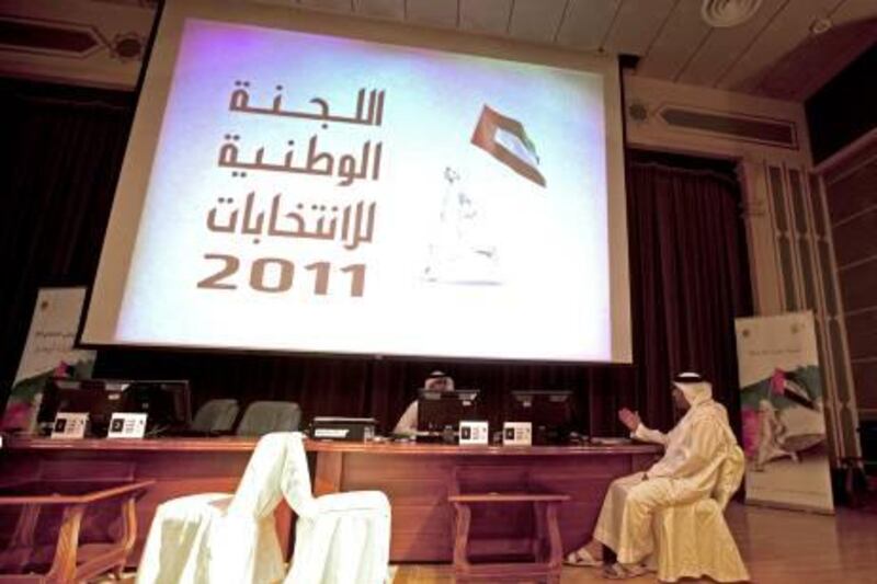 Sharjah, August 14, 2011 - Salim bin Huwaidan, a candidate for the FNC from Al Dhaid, registers for this years elections at the Cultural Palace in Sharjah City, Sharjah, August 14, 2011. The elections take place September 24. The screen says The National Commission for Elections. (Jeff Topping/The National) 